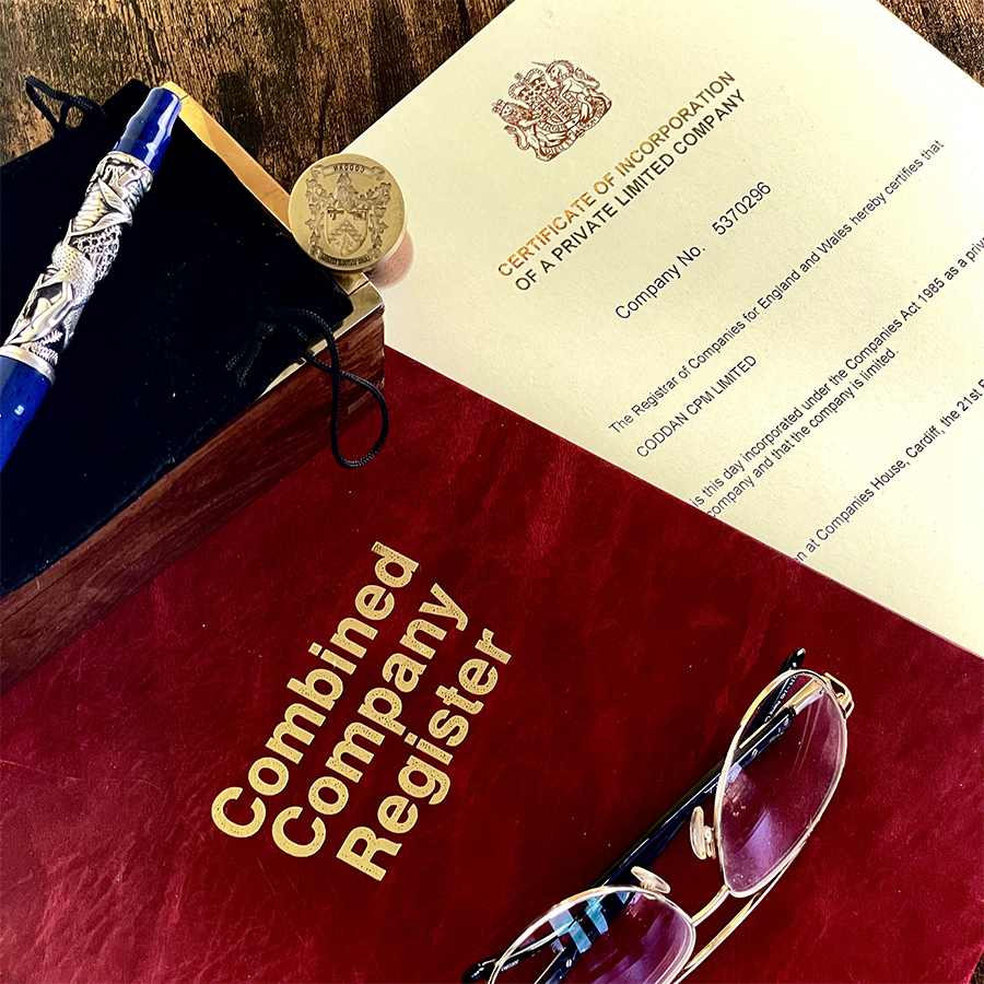 A table featuring a pen, a pair of glasses, and a business combined register book, suggesting a professional business startup and setup services. A table displays a pen, glasses, and an open company official register book, creating a trusted business formation service. A table featuring a pen, a pair of glasses, and a business combined register book, suggesting a professional business startup and setup services. A table displays a pen, glasses, and an open company official register book, creating a trusted business formation service.